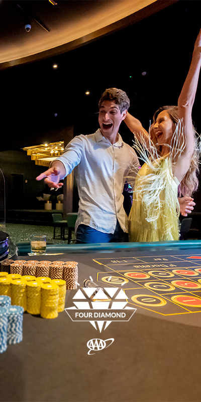  Young couple in the Casino of the Lopesan Costa Bávaro Resort, Spa & Casino in Punta Cana, Dominican Republic 